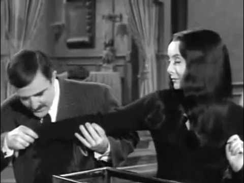gomex and morticia kissing arms