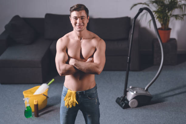 shirtless man cleaning