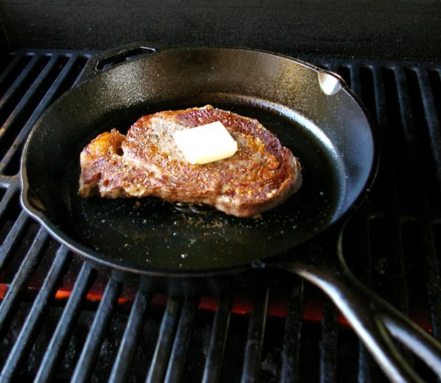 Steak in grill butter